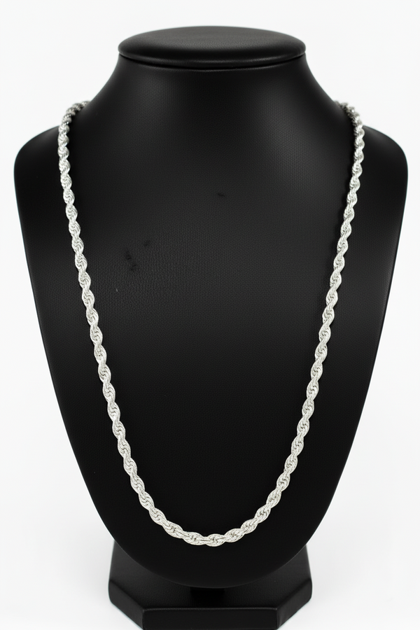Silver chain necklace on a black mannequin bust against a white background